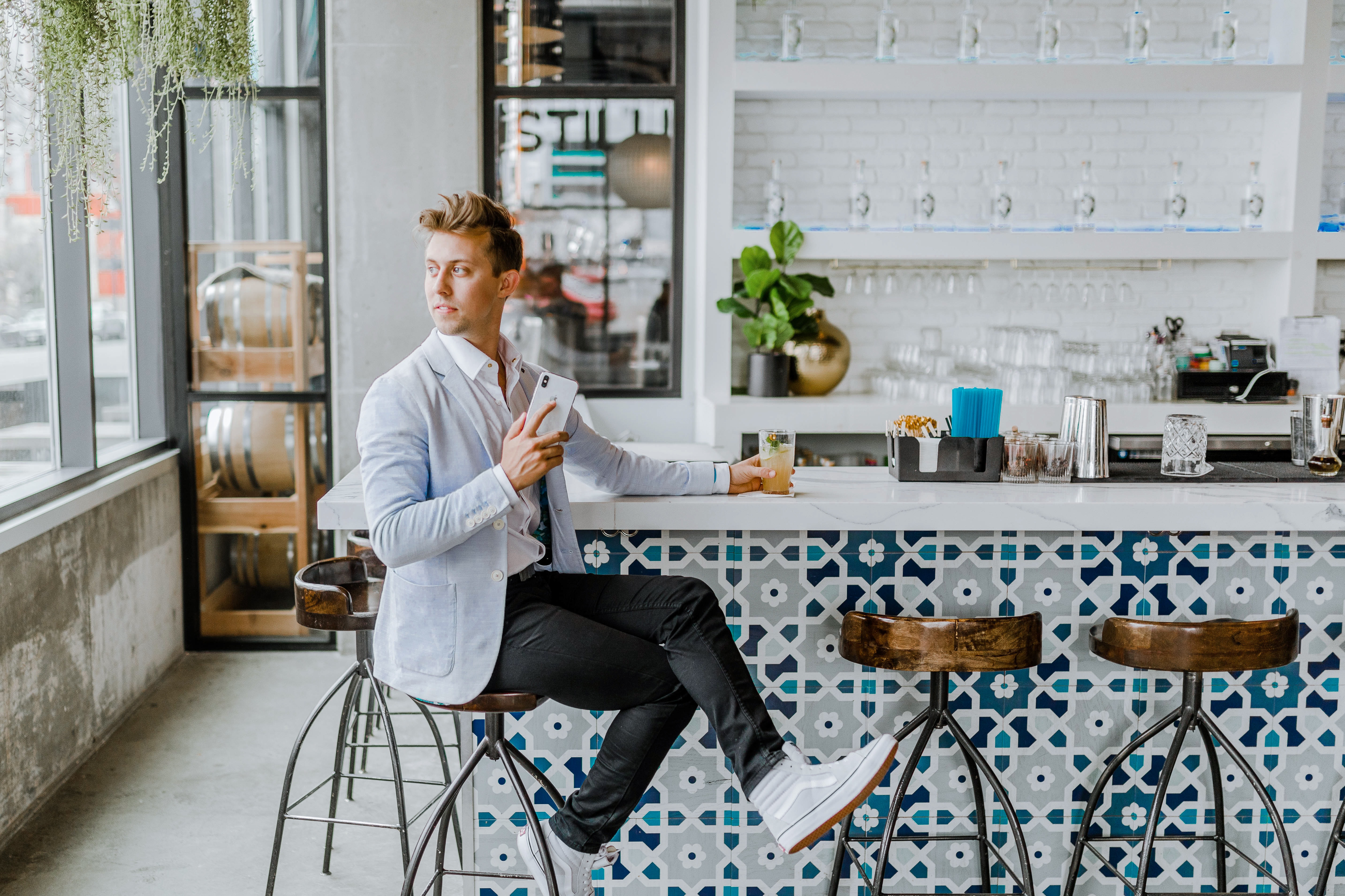 A young man sitting in a restaurant